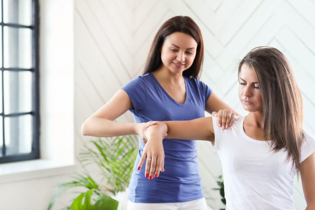 female physiotherapist treating patient for Carpal Tunnel Syndrome