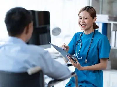 physical therapist helping patient